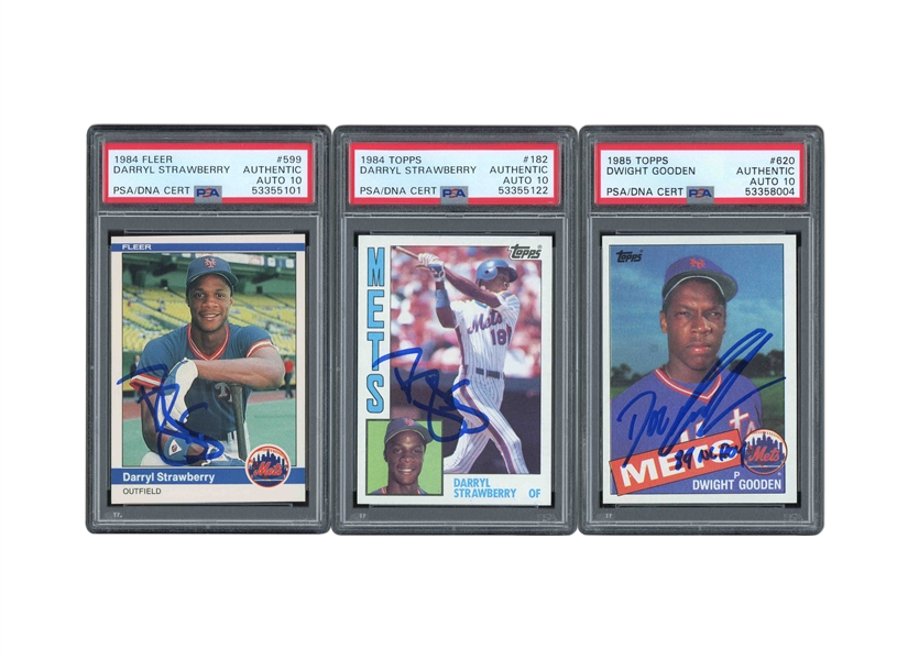 1980S N.Y. METS SIGNED ROOKIE CARD TRIO OF 84 TOPPS #182 & FLEER #599 DARRYL STRAWBERRY PLUS 85 TOPPS #620 DWIGHT GOODEN - ALL PSA AUTHENTIC, PSA/DNA 10 AUTOS.
