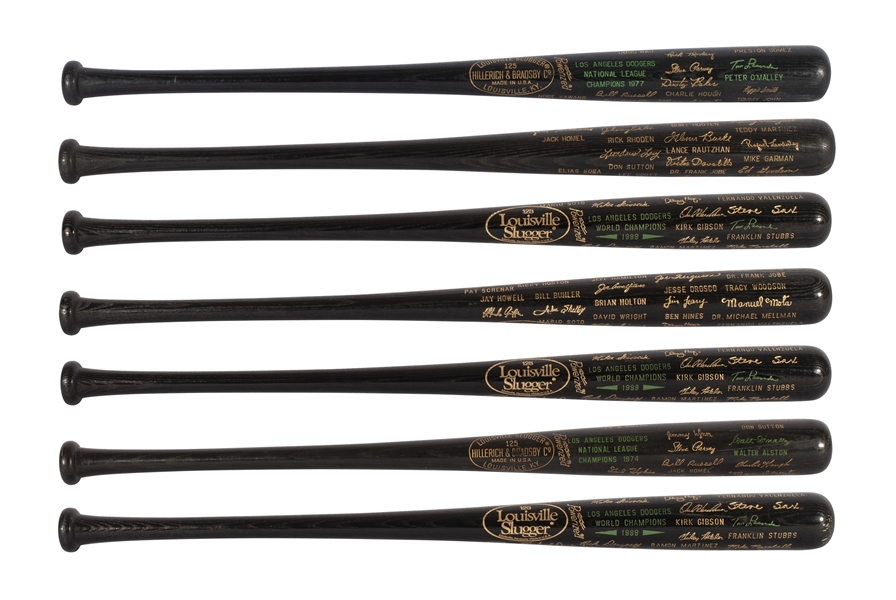 GROUP OF (7) NATIONAL LEAGUE AND WORLD SERIES COMMEMORATIVE BLACK BATS (FRED CLAIRE COLLECTION)