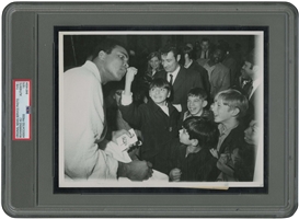 1970 Muhammad Ali (Signing for Kids) Original Photograph – PSA/DNA Type 1