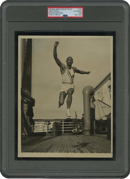 Dazzling 1936 Jesse Owens AP Original Photograph Practicing Long Jump on Top Deck of S.S. Manhattan During Transatlantic Voyage to Berlin Olympics – PSA/DNA Type 1